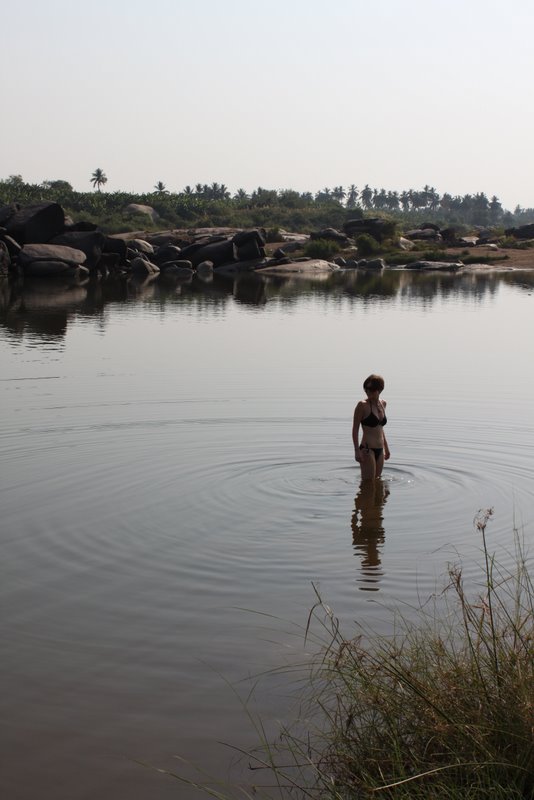 There is a little branch of the river just north-east of Shanti guesthouse that moves veeery slowly. Slowly enough that there is no apparent water movement at all. It's a perfect swimming spot.